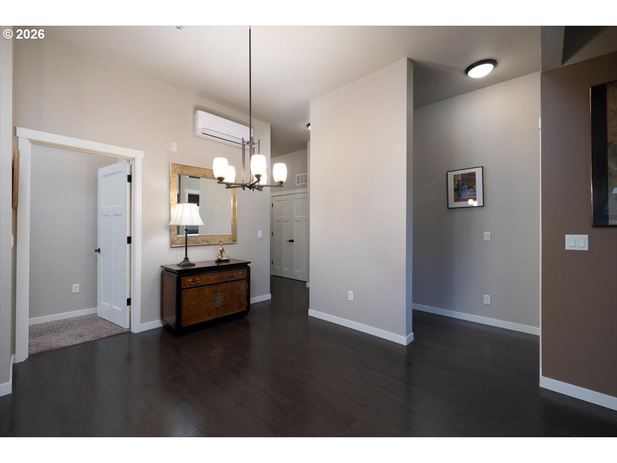 13895 Southwest Meridian Street, Unit 412 Beaverton, OR 97005 - Photo 10 of 38 a view of empty room with wooden floor