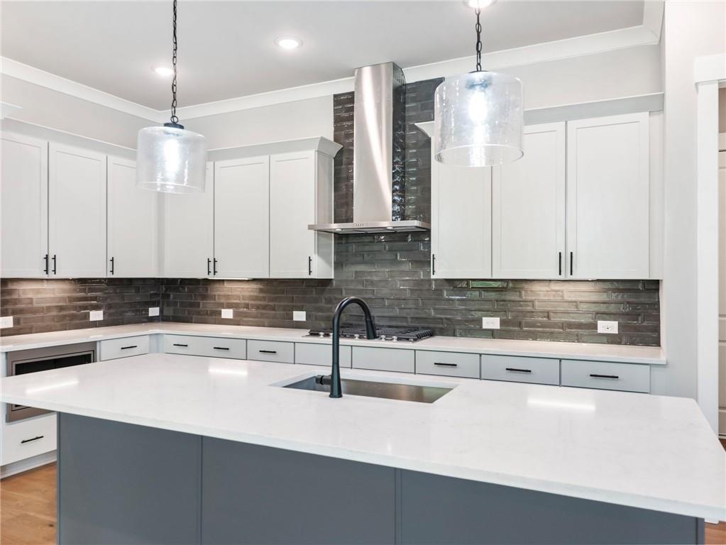 170 Ewing Way Dacula, GA 30019 - Photo 11 of 45 a kitchen with a sink a stove and cabinets