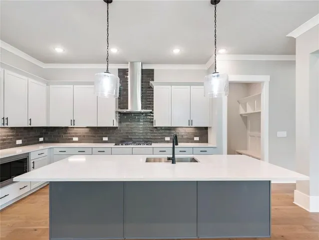 a kitchen with a sink cabinets and window