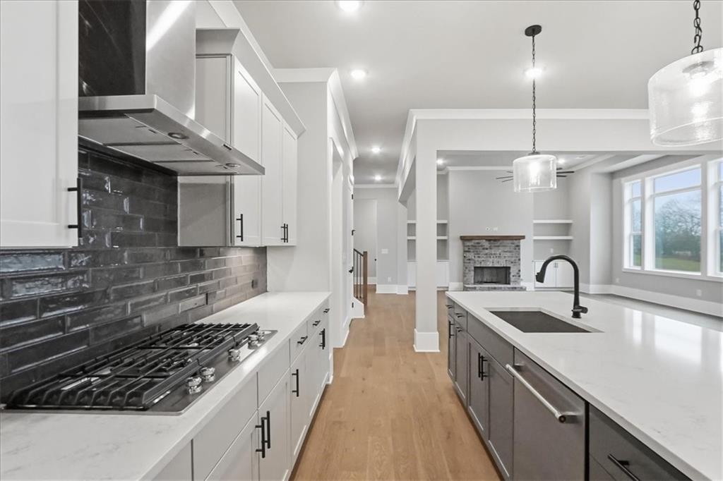 170 Ewing Way Dacula, GA 30019 - Photo 18 of 67 a kitchen with kitchen island granite countertop a sink stainless steel appliances and cabinets