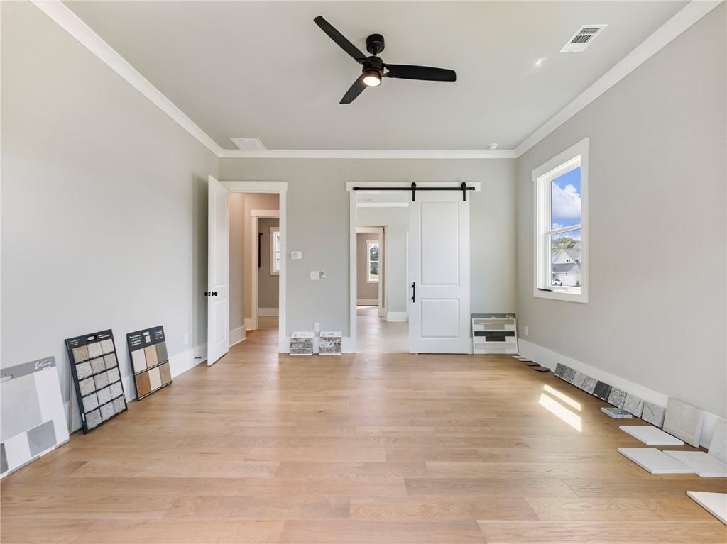 170 Ewing Way Dacula, GA 30019 - Photo 20 of 45 a view of an empty room with window and wooden floor