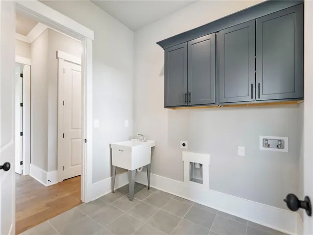 a view of a room with wooden floor and cabinet