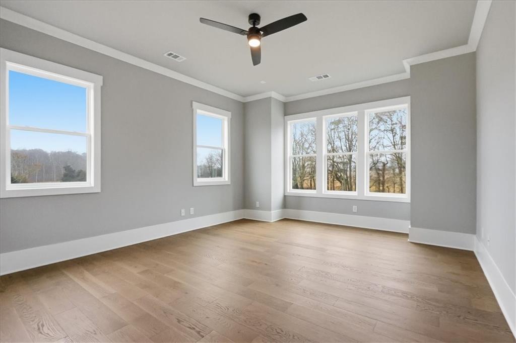 170 Ewing Way Dacula, GA 30019 - Photo 29 of 67 a view of an empty room with wooden floor and a window