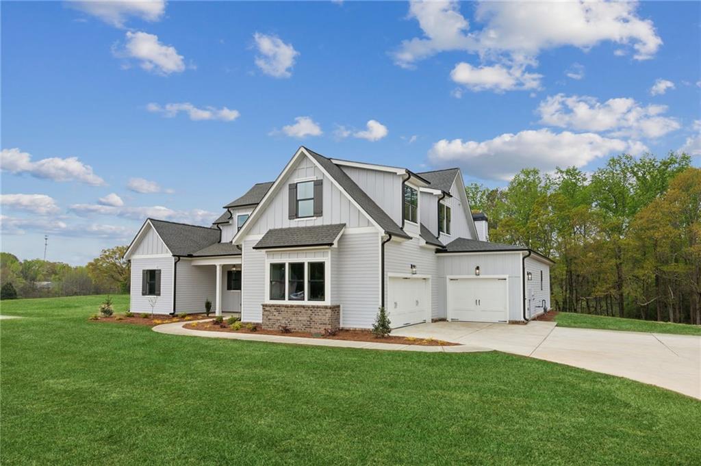170 Ewing Way Dacula, GA 30019 - Photo 3 of 45 a front view of house with yard and green space