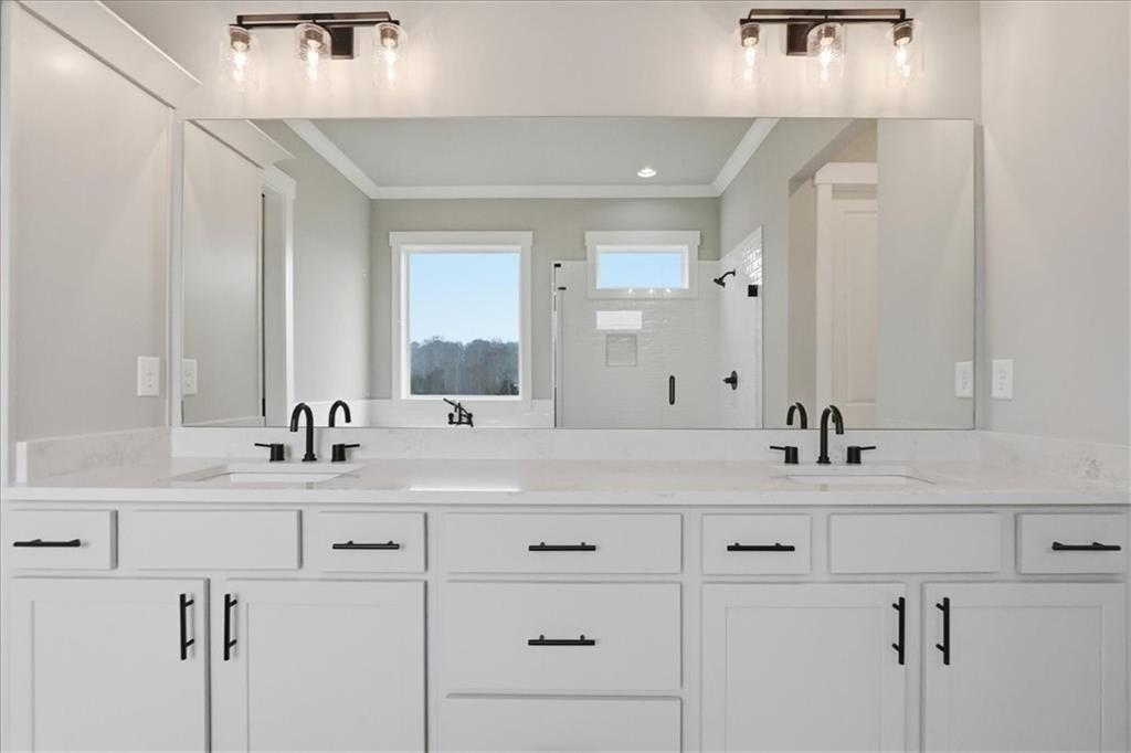 170 Ewing Way Dacula, GA 30019 - Photo 33 of 67 a bathroom with a sink and a mirror