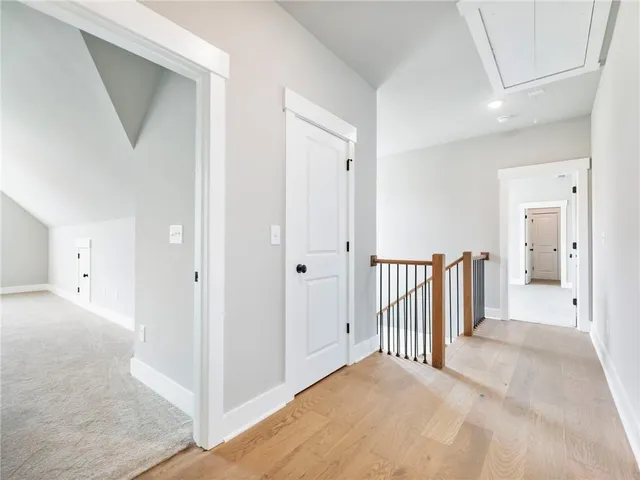 a view of a hallway with closet and entryway