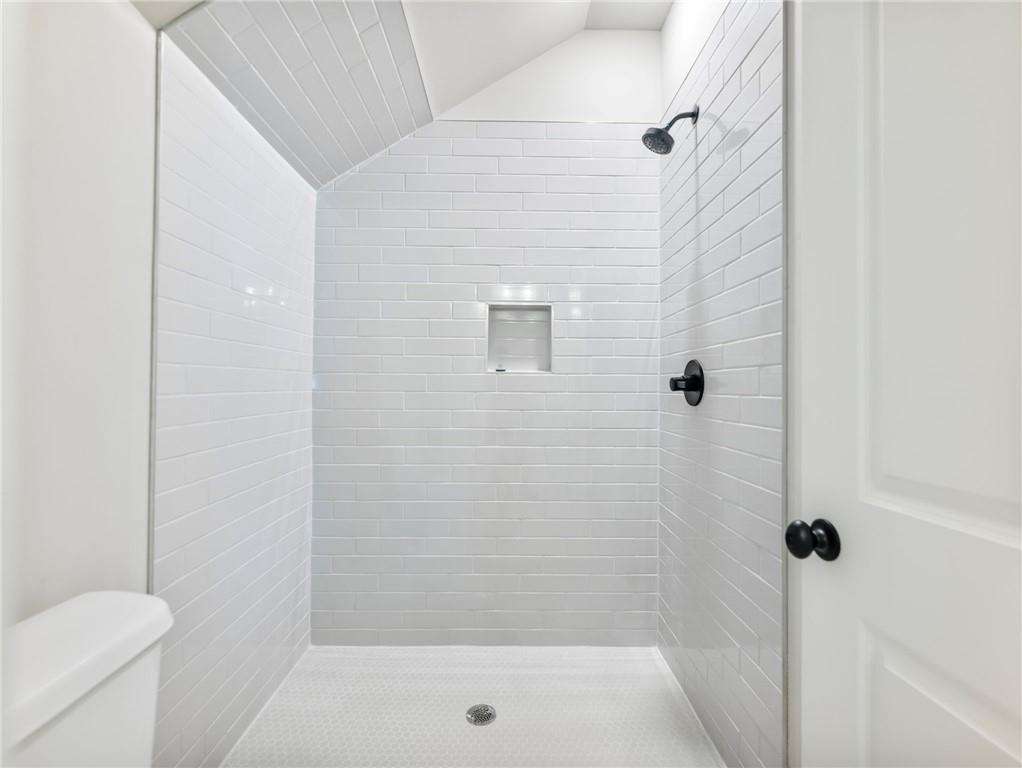 170 Ewing Way Dacula, GA 30019 - Photo 41 of 45 a bathroom with a shower and a toilet