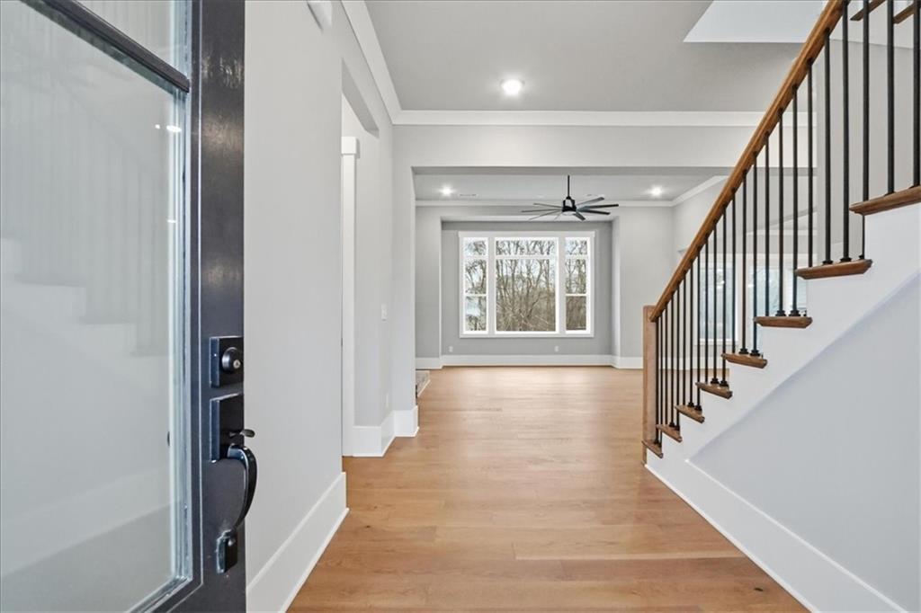 170 Ewing Way Dacula, GA 30019 - Photo 5 of 67 a view of an entryway with wooden floor and stairs