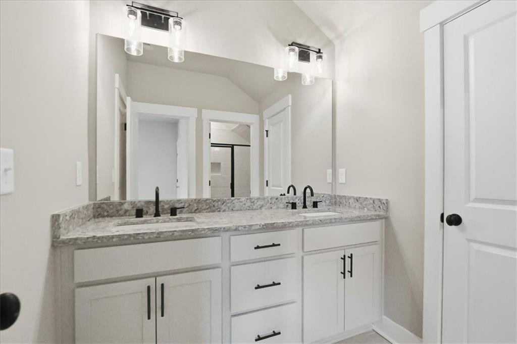 170 Ewing Way Dacula, GA 30019 - Photo 55 of 67 a bathroom with a granite countertop sink double and mirror