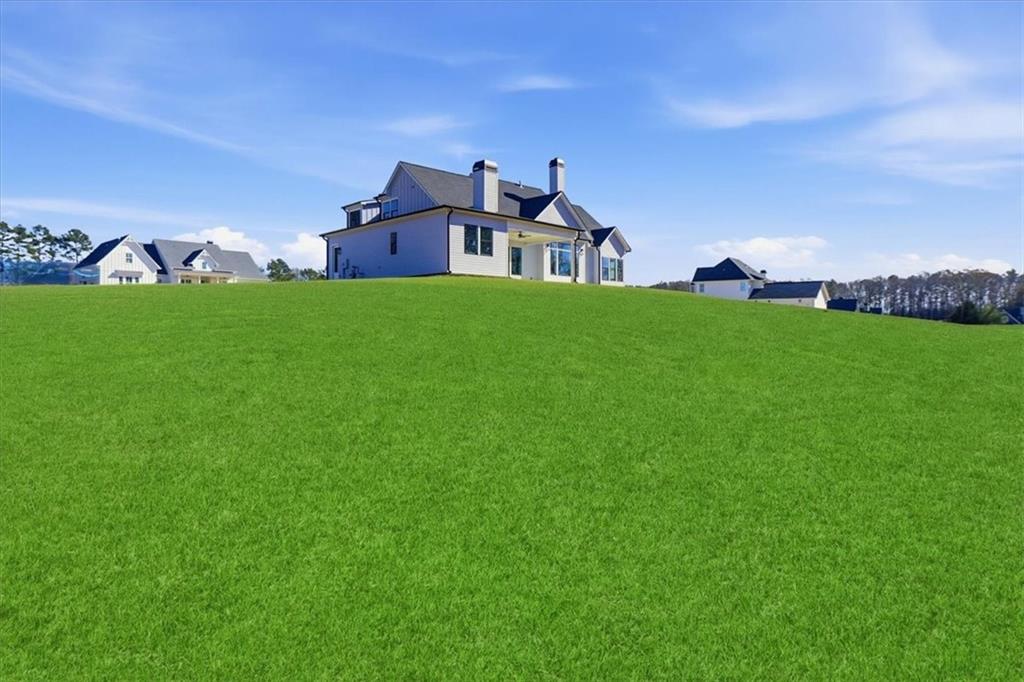 170 Ewing Way Dacula, GA 30019 - Photo 64 of 67 a front view of a house with garden