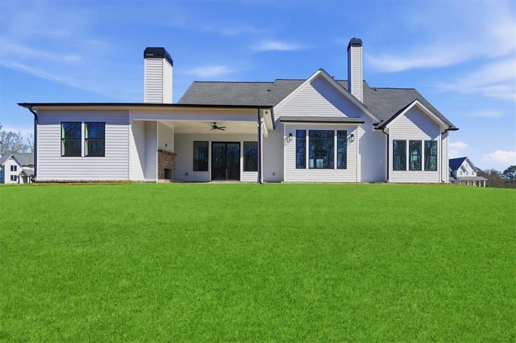 170 Ewing Way Dacula, GA 30019 - Photo 65 of 67 a front view of a house with garden