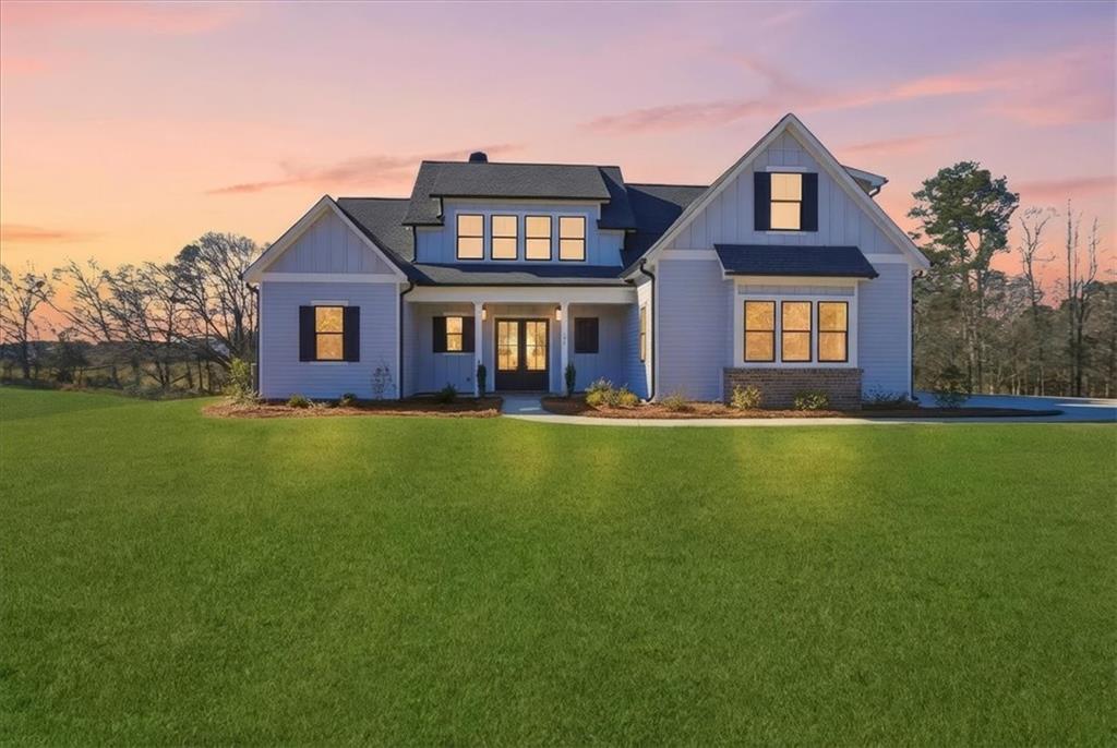 170 Ewing Way Dacula, GA 30019 - Photo 66 of 67 a front view of a house with garden