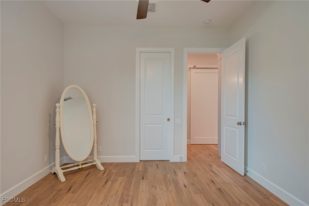 43362 Waterside Trail Punta Gorda, FL 33982 - Photo 26 of 50 a view of a room with wooden floor and a window
