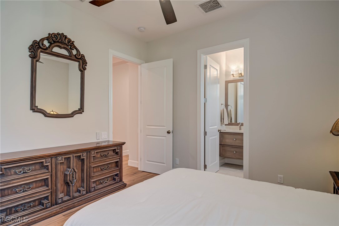 43362 Waterside Trail Punta Gorda, FL 33982 - Photo 28 of 50 a bedroom with furniture and a mirror