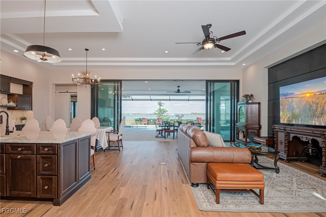 43362 Waterside Trail Punta Gorda, FL 33982 - Photo 32 of 50 a living room with furniture and a flat screen tv