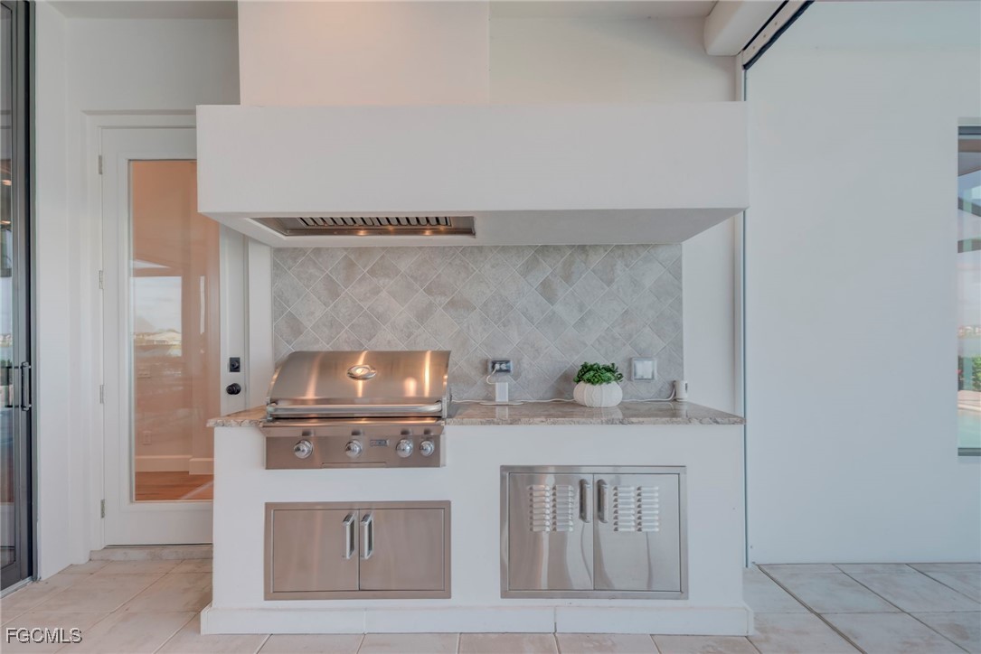 43362 Waterside Trail Punta Gorda, FL 33982 - Photo 34 of 50 a kitchen with stainless steel appliances a stove and cabinets