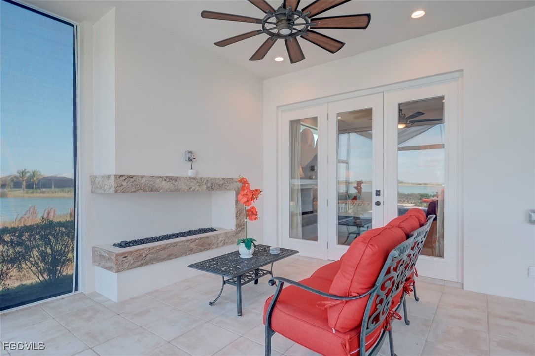 43362 Waterside Trail Punta Gorda, FL 33982 - Photo 35 of 50 a living room with furniture a rug and a potted plant