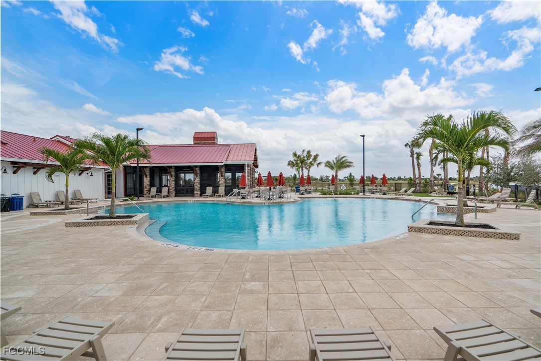 43362 Waterside Trail Punta Gorda, FL 33982 - Photo 50 of 50 a view of swimming pool with outdoor seating and a patio
