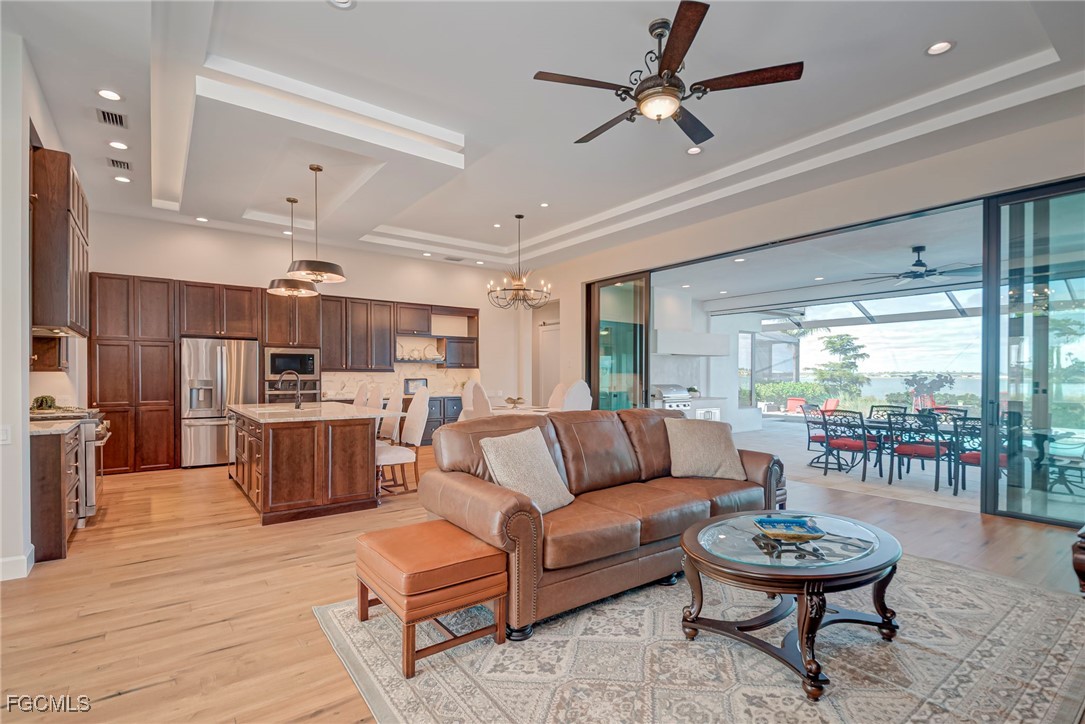 43362 Waterside Trail Punta Gorda, FL 33982 - Photo 5 of 50 a living room with furniture and a wooden floor