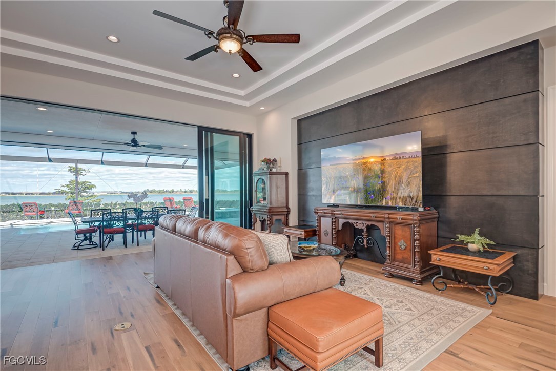 43362 Waterside Trail Punta Gorda, FL 33982 - Photo 6 of 50 a living room with furniture and a floor to ceiling window
