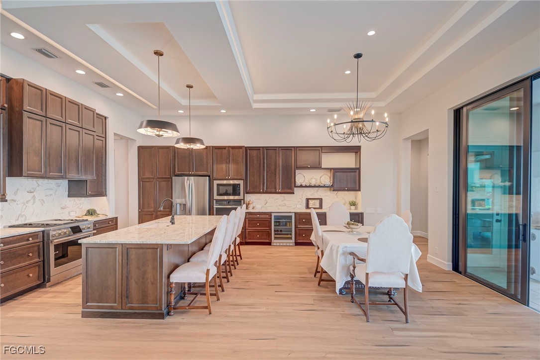 43362 Waterside Trail Punta Gorda, FL 33982 - Photo 8 of 50 a large kitchen with a table and chairs