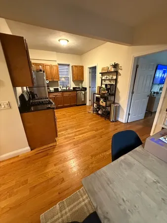 a view of a living room and kitchen