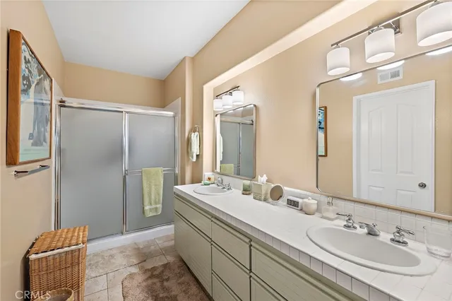 a view of a patio with couches table and chairs and potted plants