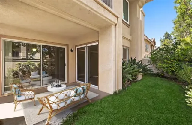 a view of a bedroom with window and hardwood floor