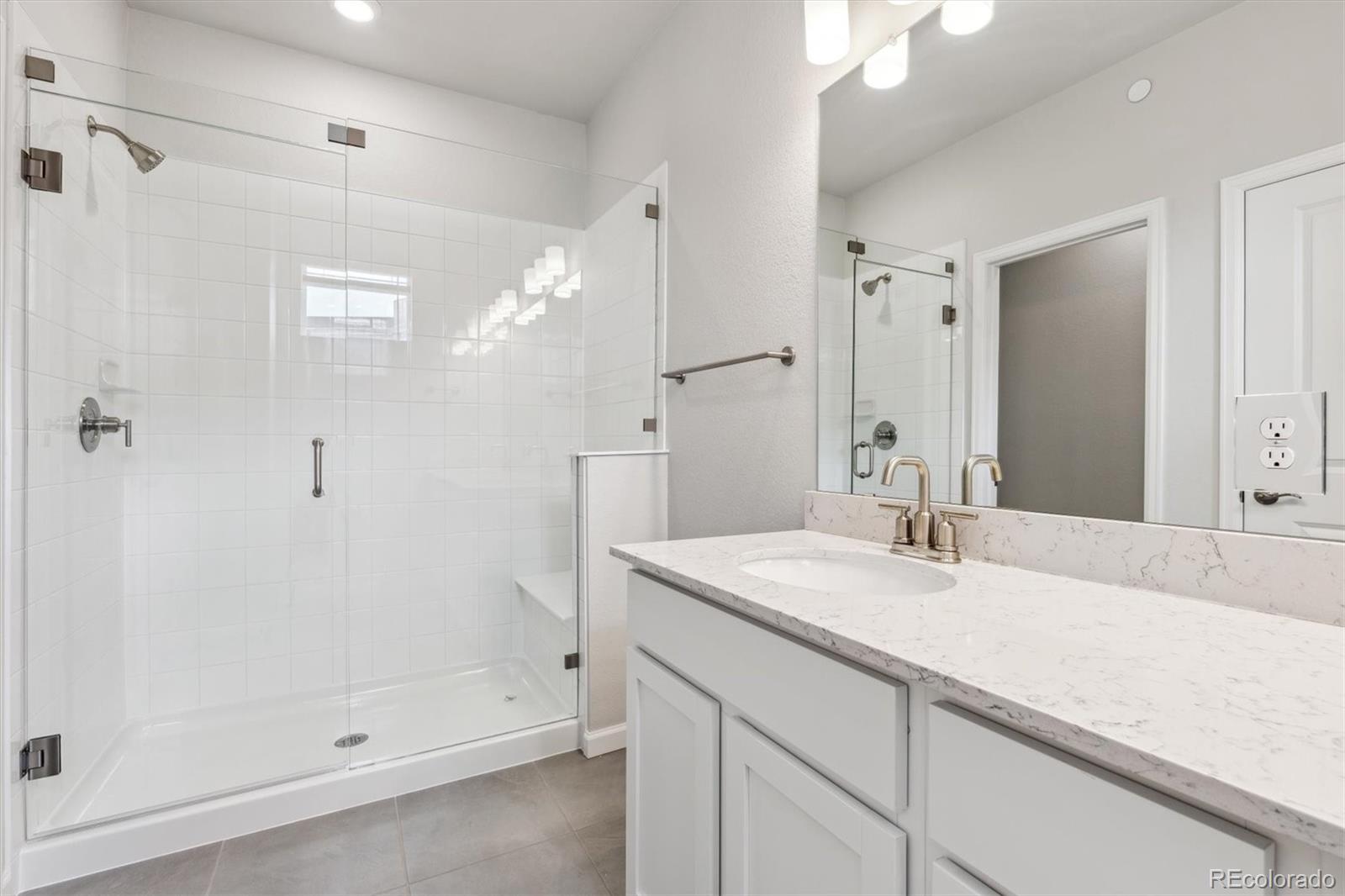 465 Interlocken Boulevard, Unit 101 Broomfield, CO 80021 - Photo 12 of 17 a bathroom with a sink and a mirror