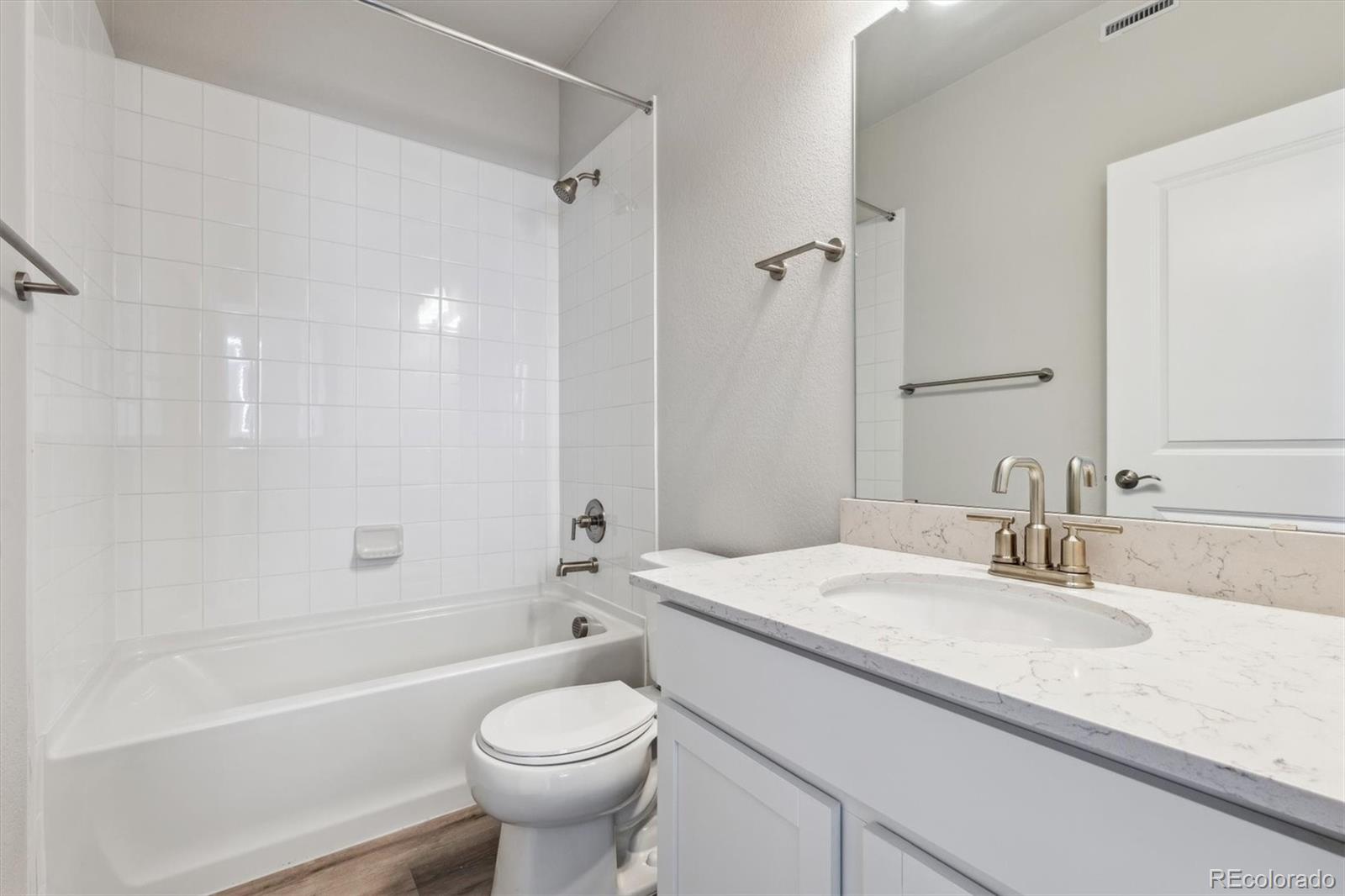 465 Interlocken Boulevard, Unit 101 Broomfield, CO 80021 - Photo 13 of 17 a bathroom with a sink a toilet and a bathtub