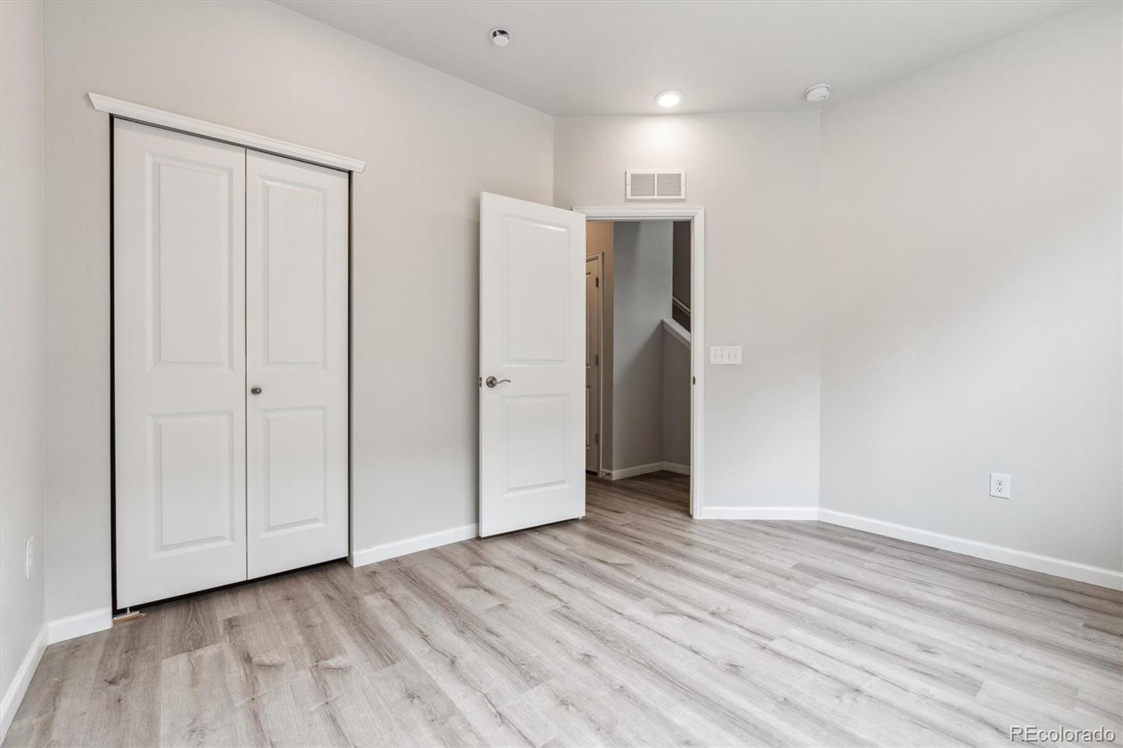 465 Interlocken Boulevard, Unit 101 Broomfield, CO 80021 - Photo 7 of 17 a view of an empty room with wooden floor