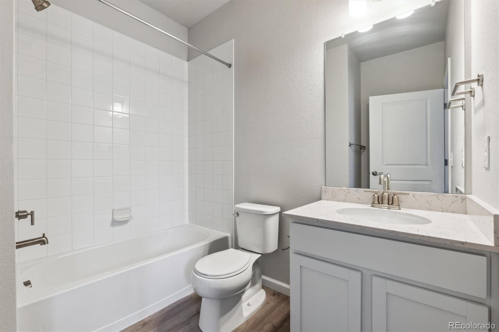 465 Interlocken Boulevard, Unit 101 Broomfield, CO 80021 - Photo 8 of 17 a bathroom with a sink a toilet and shower
