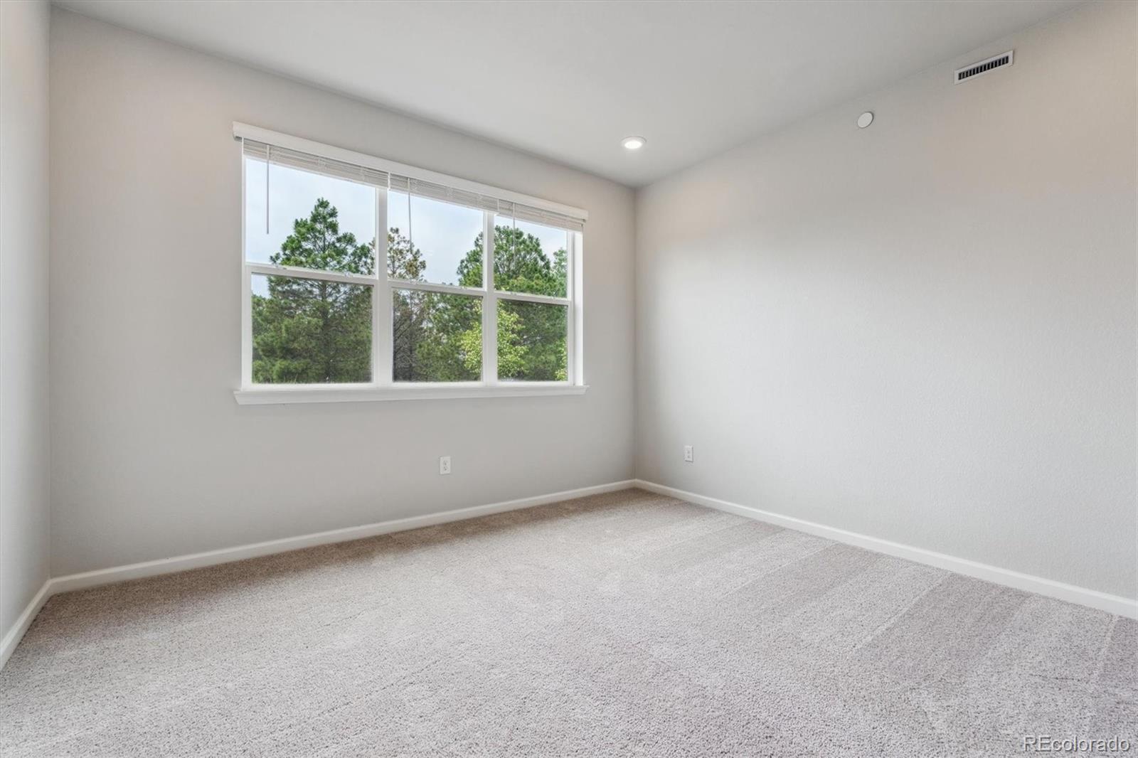 465 Interlocken Boulevard, Unit 101 Broomfield, CO 80021 - Photo 10 of 17 an empty room with a window