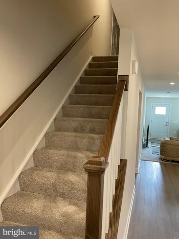a view of a balcony with wooden floor