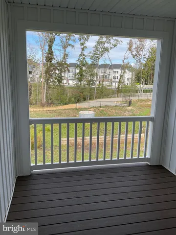 a view of a livingroom with an empty space and window