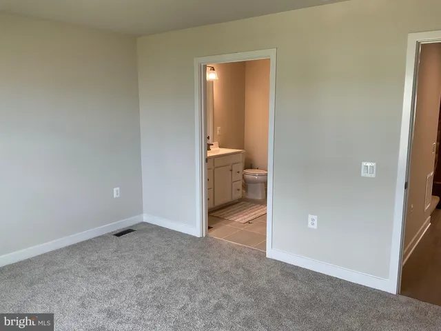 a bathroom with a double vanity sink and mirror