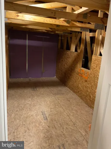 an empty room with closet area