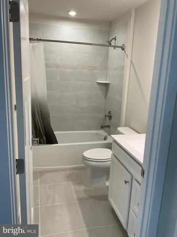 a view of an empty room and entryway