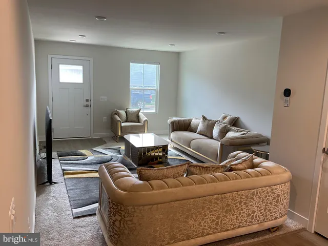 a living room with furniture and a couch
