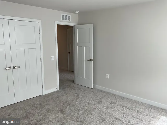 a bathroom with a glass door shower