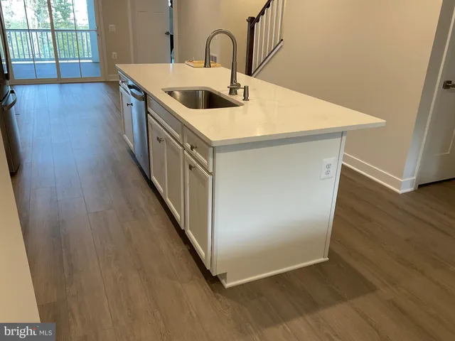 a stove top oven sitting inside of a kitchen