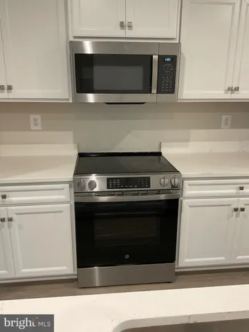a refrigerator freezer sitting inside of a kitchen
