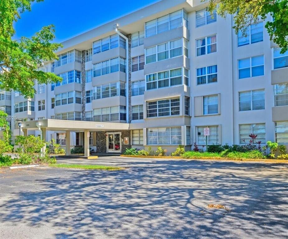 a front view of building with street