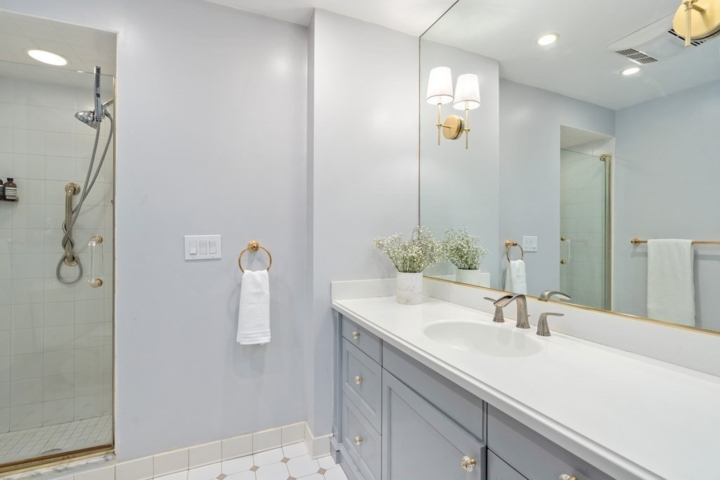 9 Penniman Road Brookline, MA 02445 - Photo 13 of 35 a bathroom with a sink tub and shower