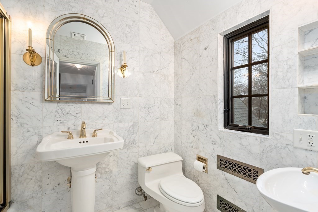 9 Penniman Road Brookline, MA 02445 - Photo 20 of 35 a bathroom with a toilet sink and mirror