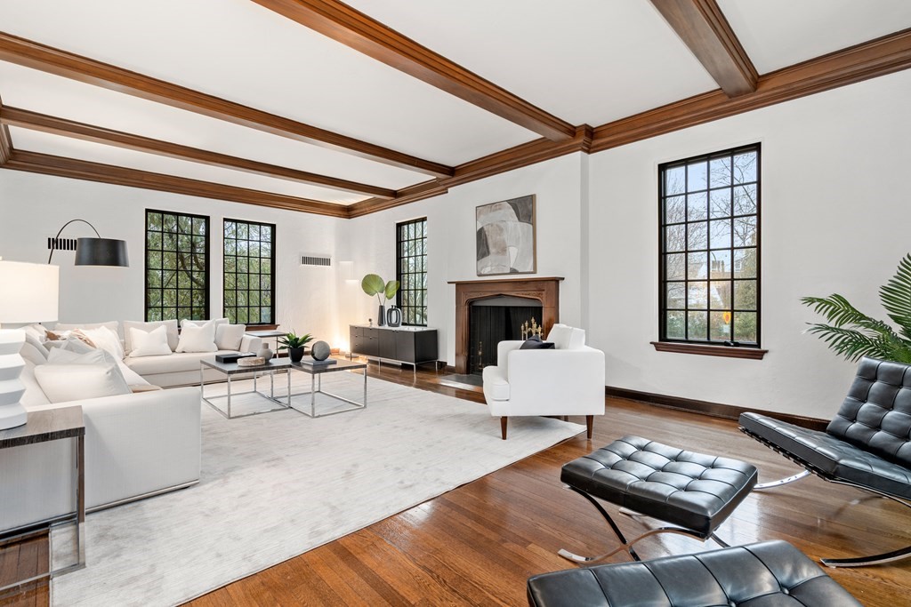 9 Penniman Road Brookline, MA 02445 - Photo 2 of 35 a living room with furniture a fireplace and a table
