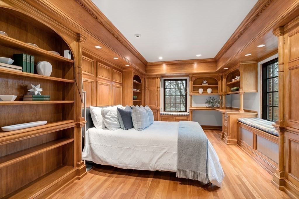 9 Penniman Road Brookline, MA 02445 - Photo 21 of 35 a bedroom with a large bed and a book shelf