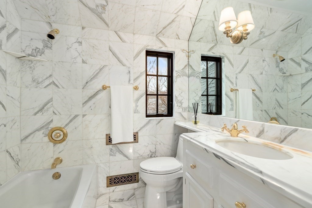 9 Penniman Road Brookline, MA 02445 - Photo 24 of 35 a bathroom with a sink a toilet and shower