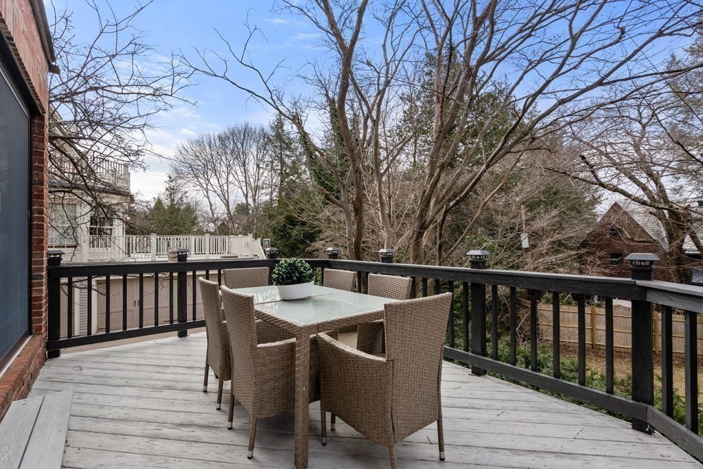 9 Penniman Road Brookline, MA 02445 - Photo 27 of 35 a view of a deck with furniture and trees