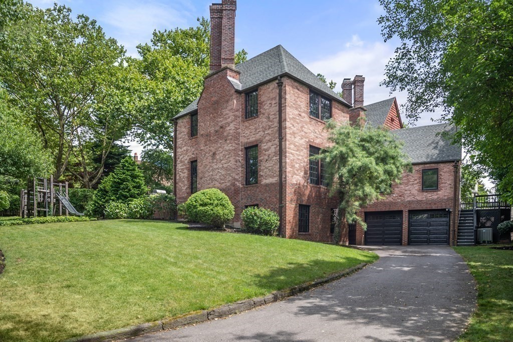 9 Penniman Road Brookline, MA 02445 - Photo 32 of 35 a front view of a house with garden